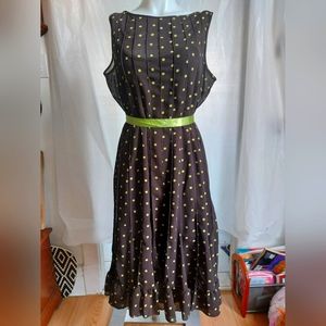 Women's brown dress with green polka dots.